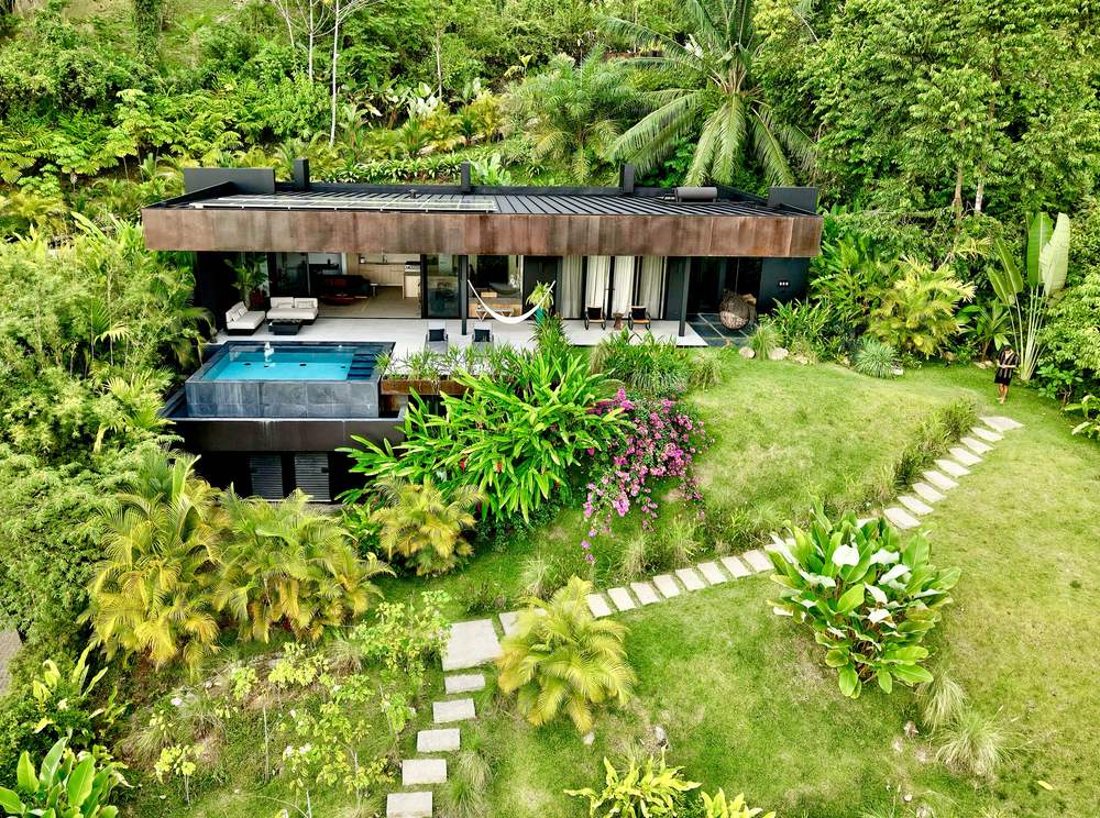 The upper villa and its plunge pool, with the stepped path down through the garden