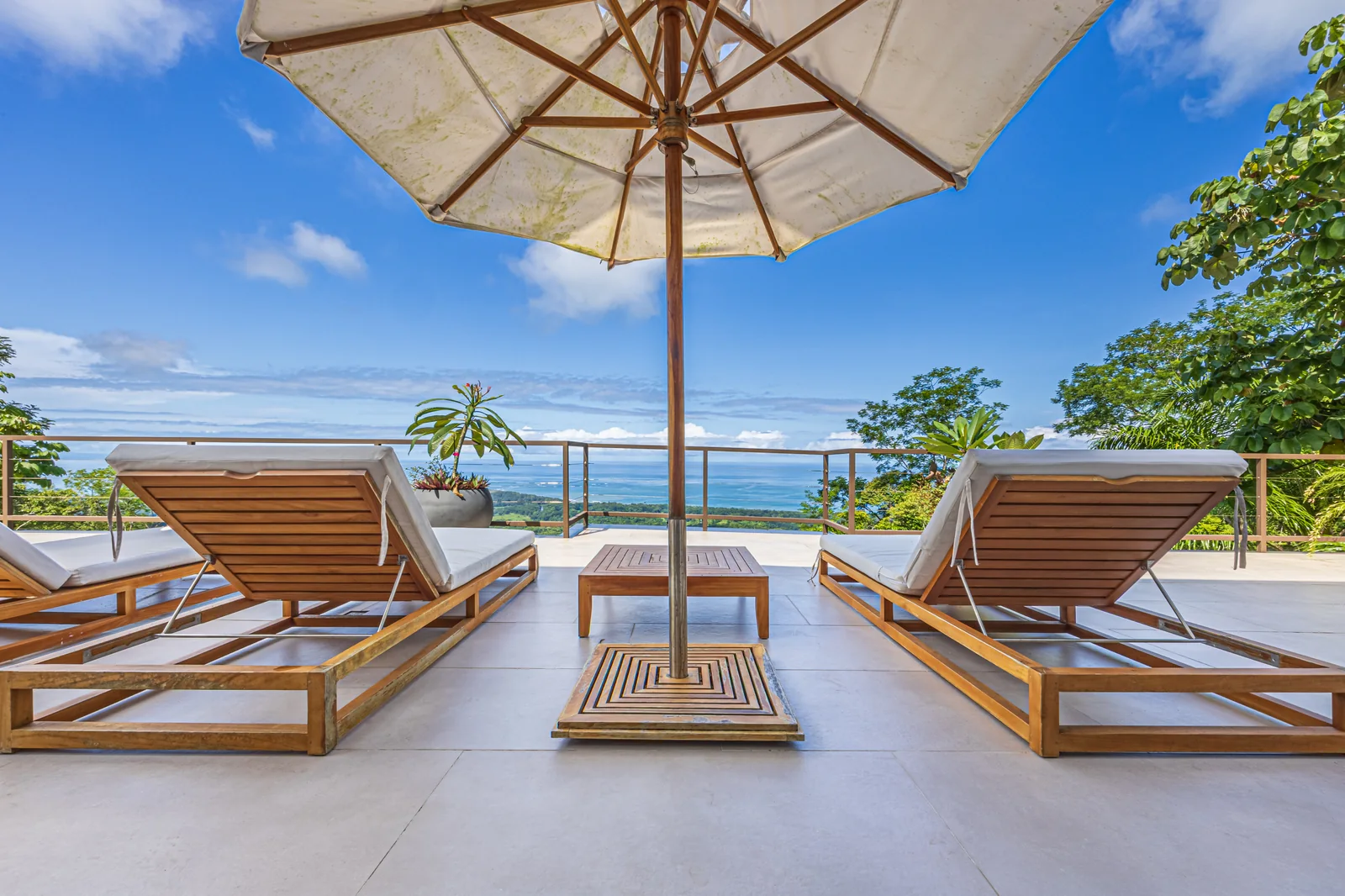 Casa Ballena &mdash; loungers under the parasol at the terrace edge