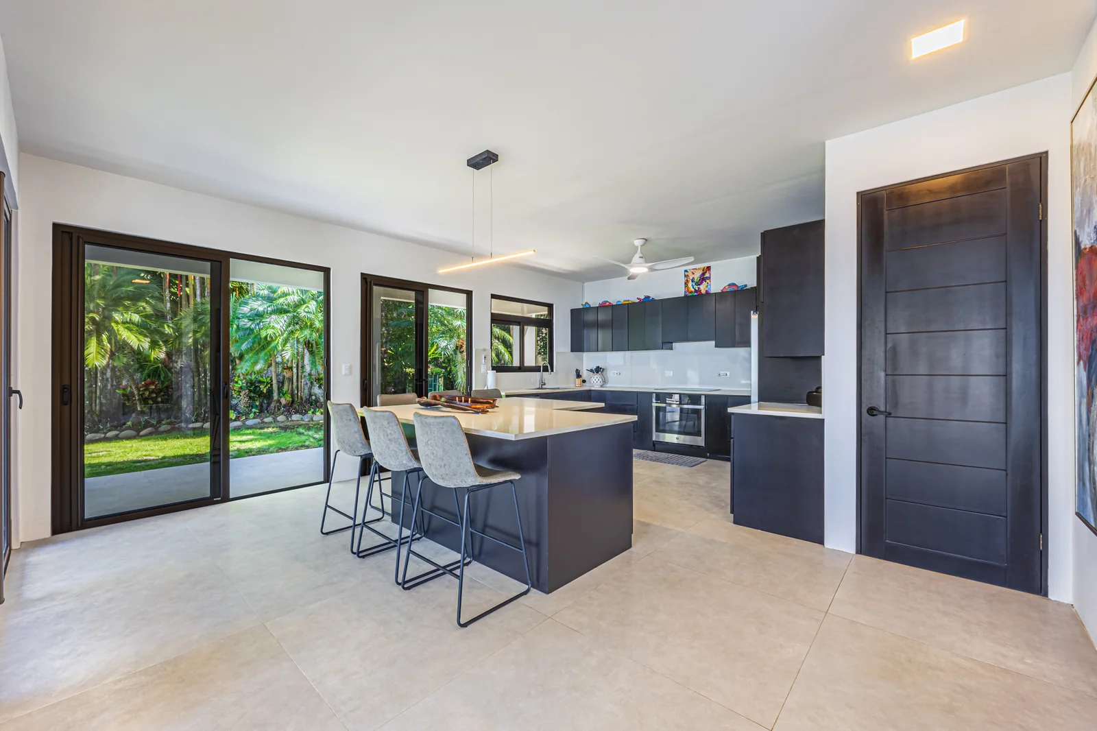 Casa Ballena &mdash; the kitchen, in dark cabinetry
