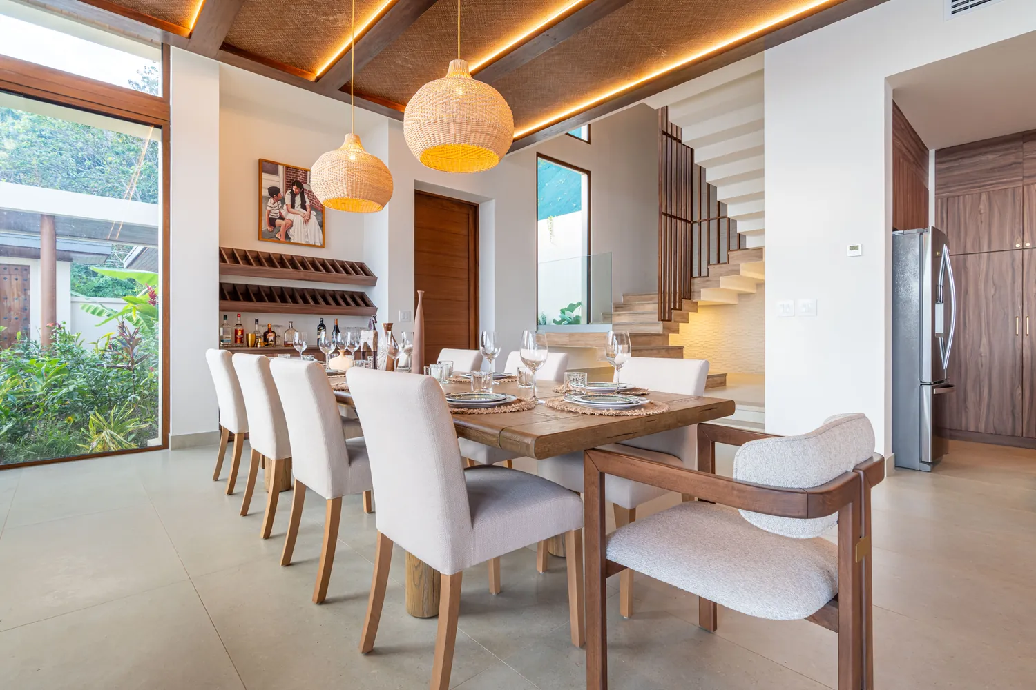 Casa Bella Vi&ntilde;a &mdash; the dining table under pendant lights