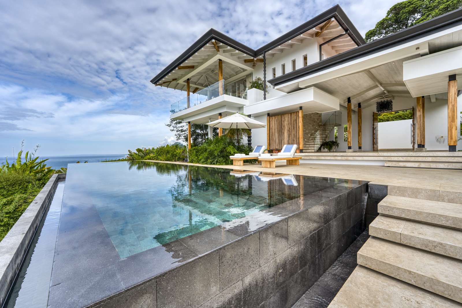 Loungers set along the length of the pool