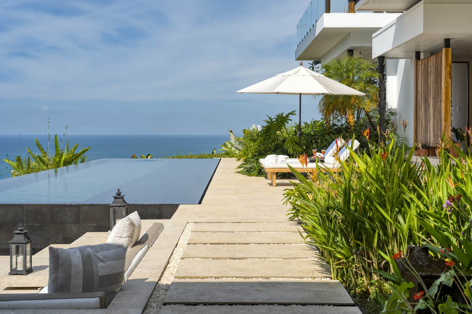 The walkway running through the planting to the pool