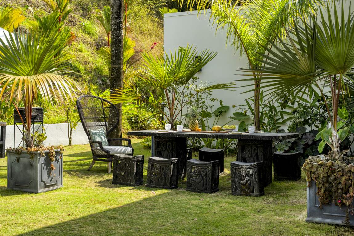 An outdoor dining table set in the garden