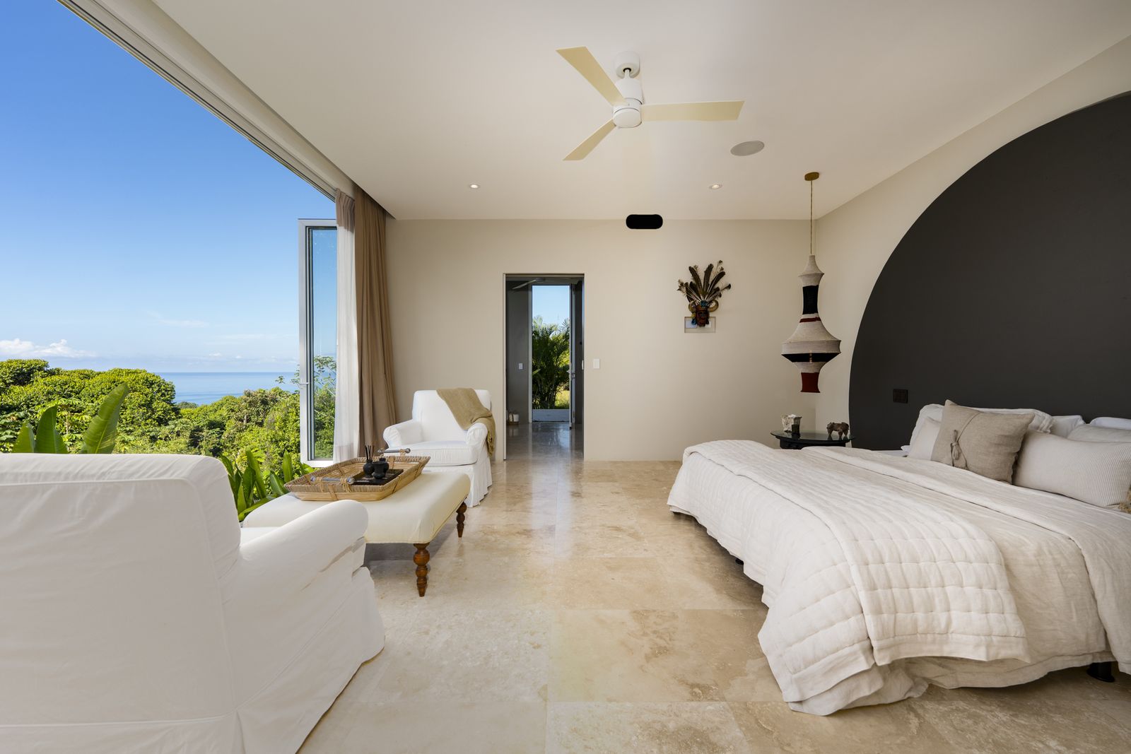 A suite with a curved headboard wall