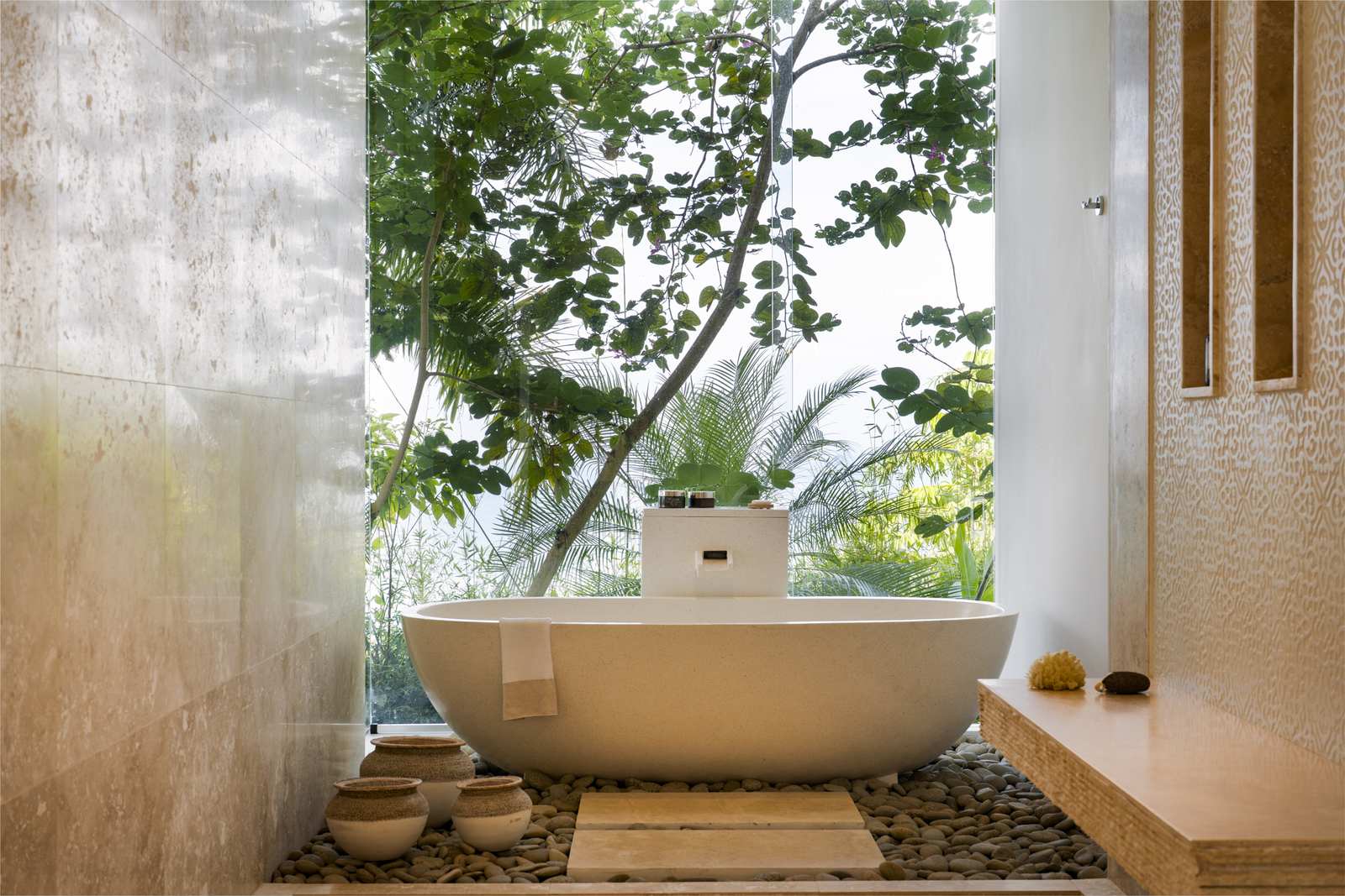 The granite tub carved in Bali, in the lower bedroom's bath