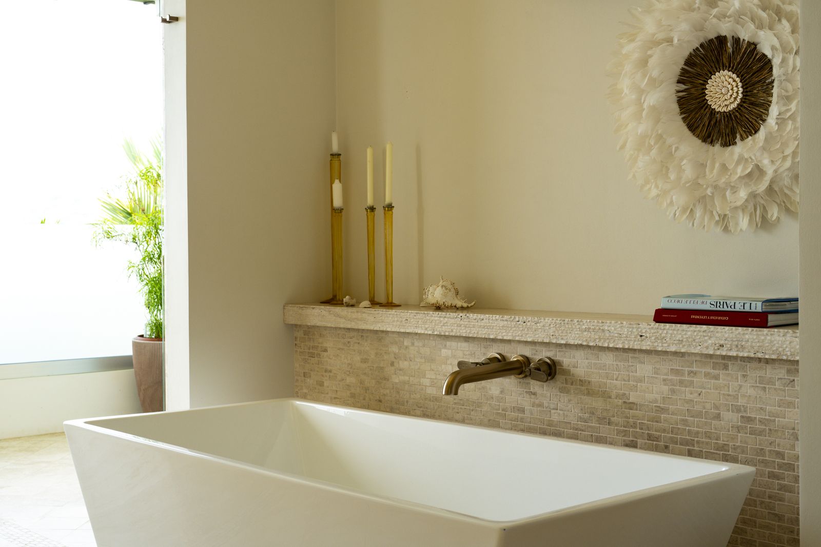 A freestanding tub set against the garden