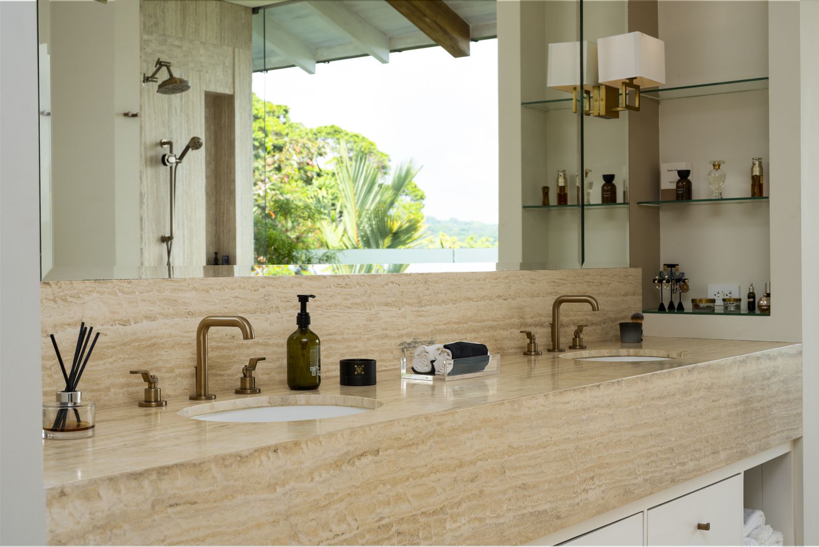 Double vanities finished in travertine