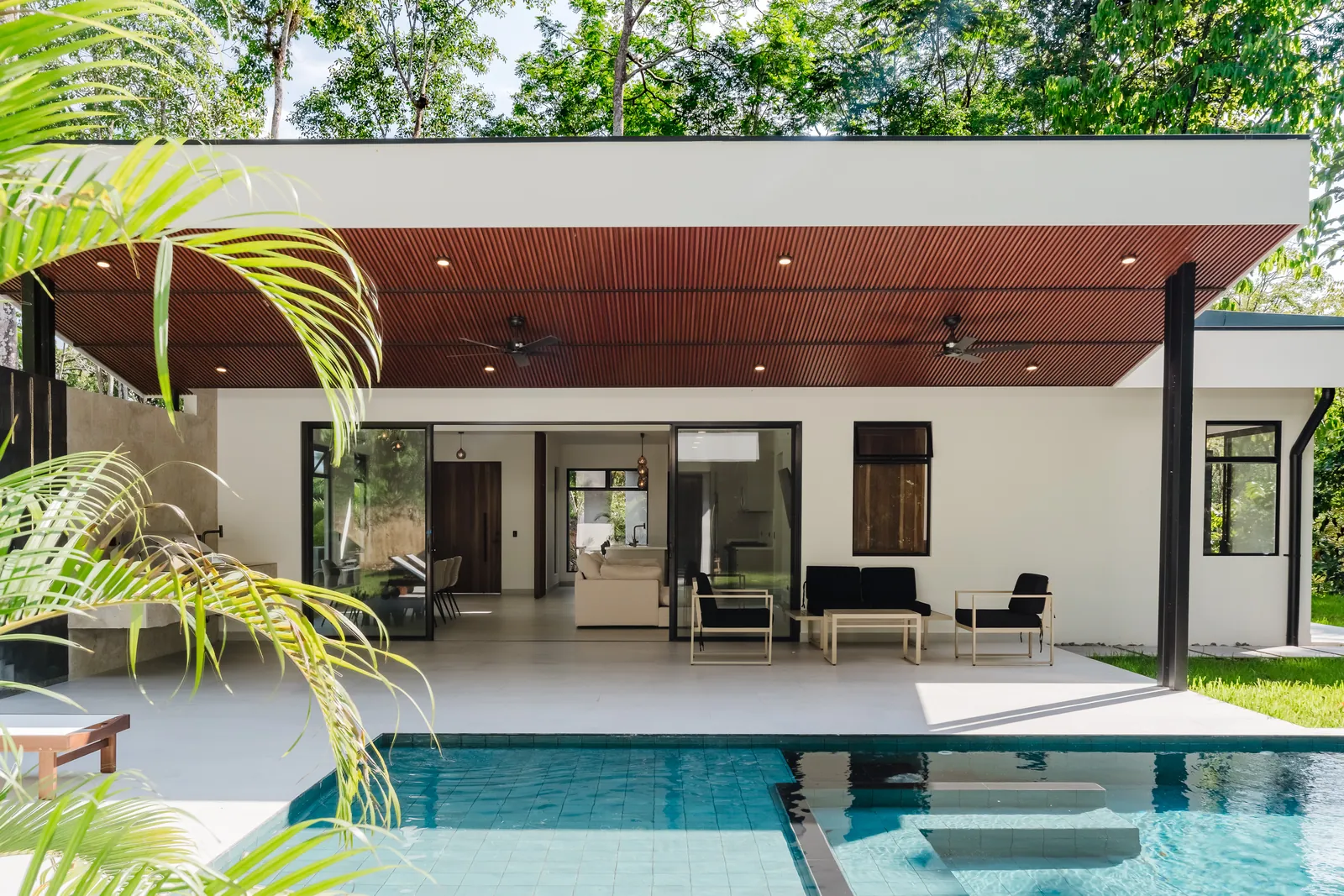 Casa Escondida &mdash; the pool and the covered terrace under its timber ceiling