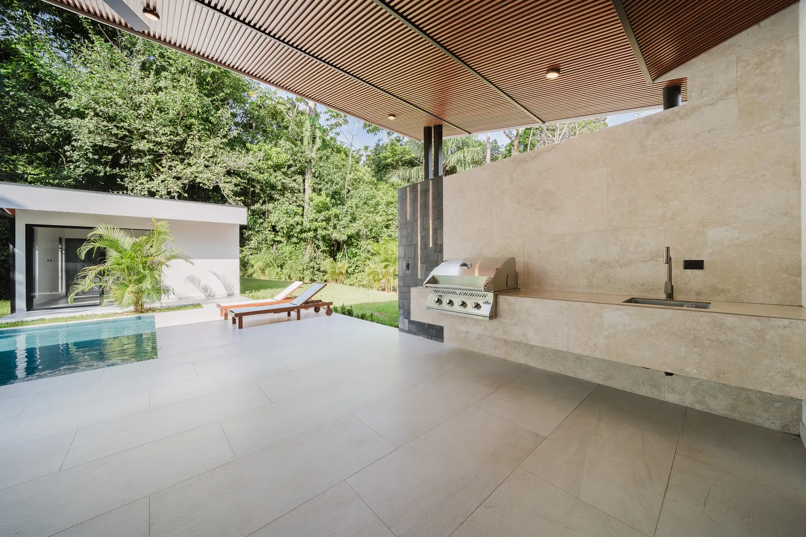 Casa Escondida &mdash; the terrace and outdoor kitchen alongside the pool