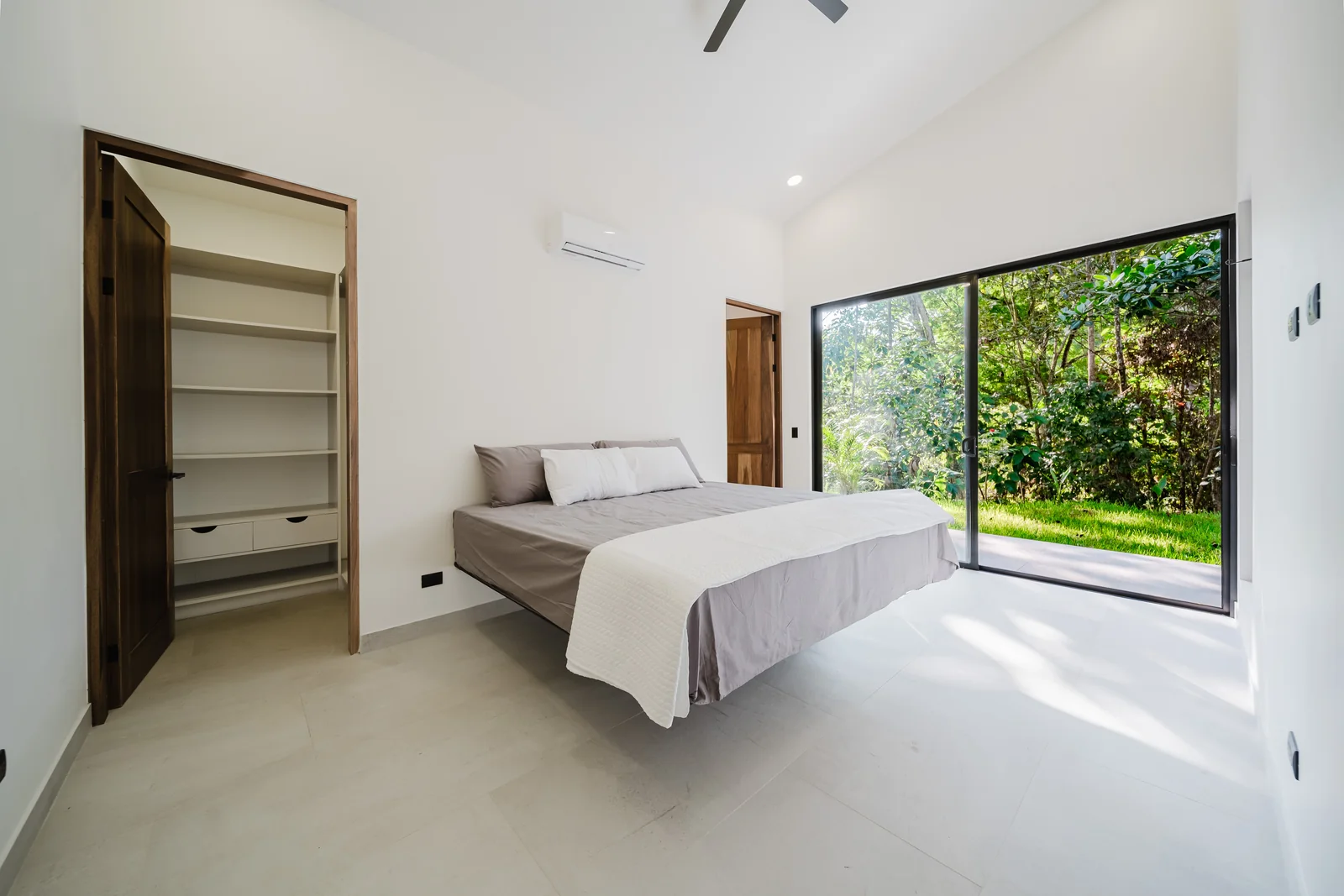 Casa Escondida &mdash; one of the three primary suites, glazed to the garden