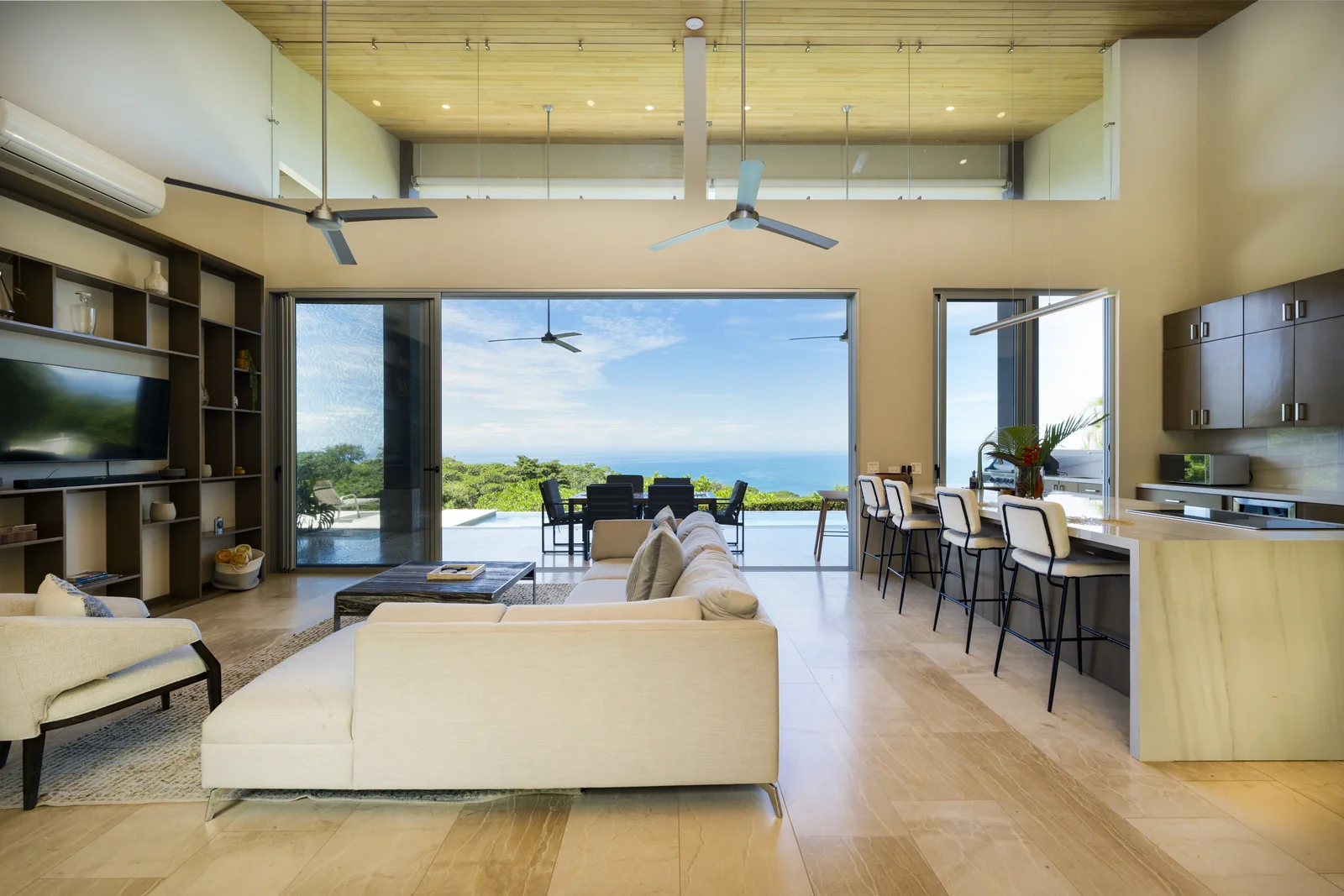 Casa Horizonte &mdash; the living room, opened along its length to the terrace