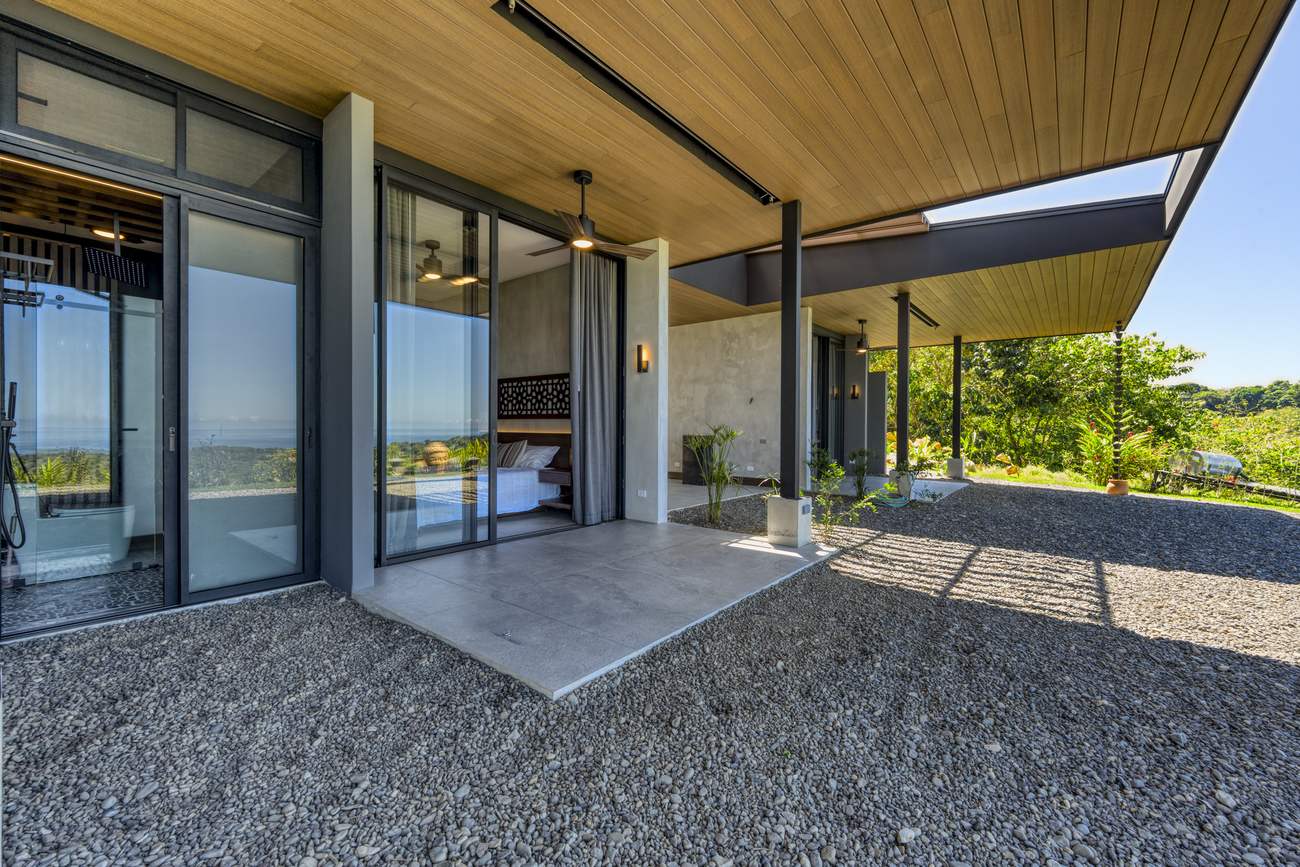 Casa Karuna &mdash; The covered breezeway running between the wings of the house