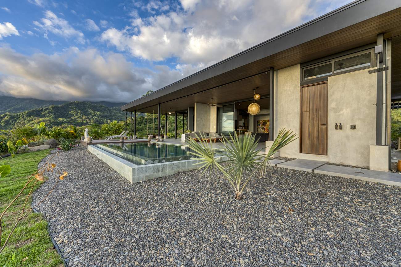 Casa Karuna &mdash; The pool and house seen across the lawn