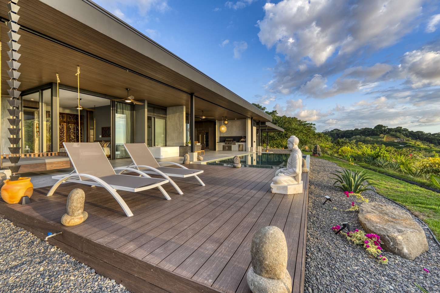 Casa Karuna &mdash; Loungers on the timber deck beside the pool