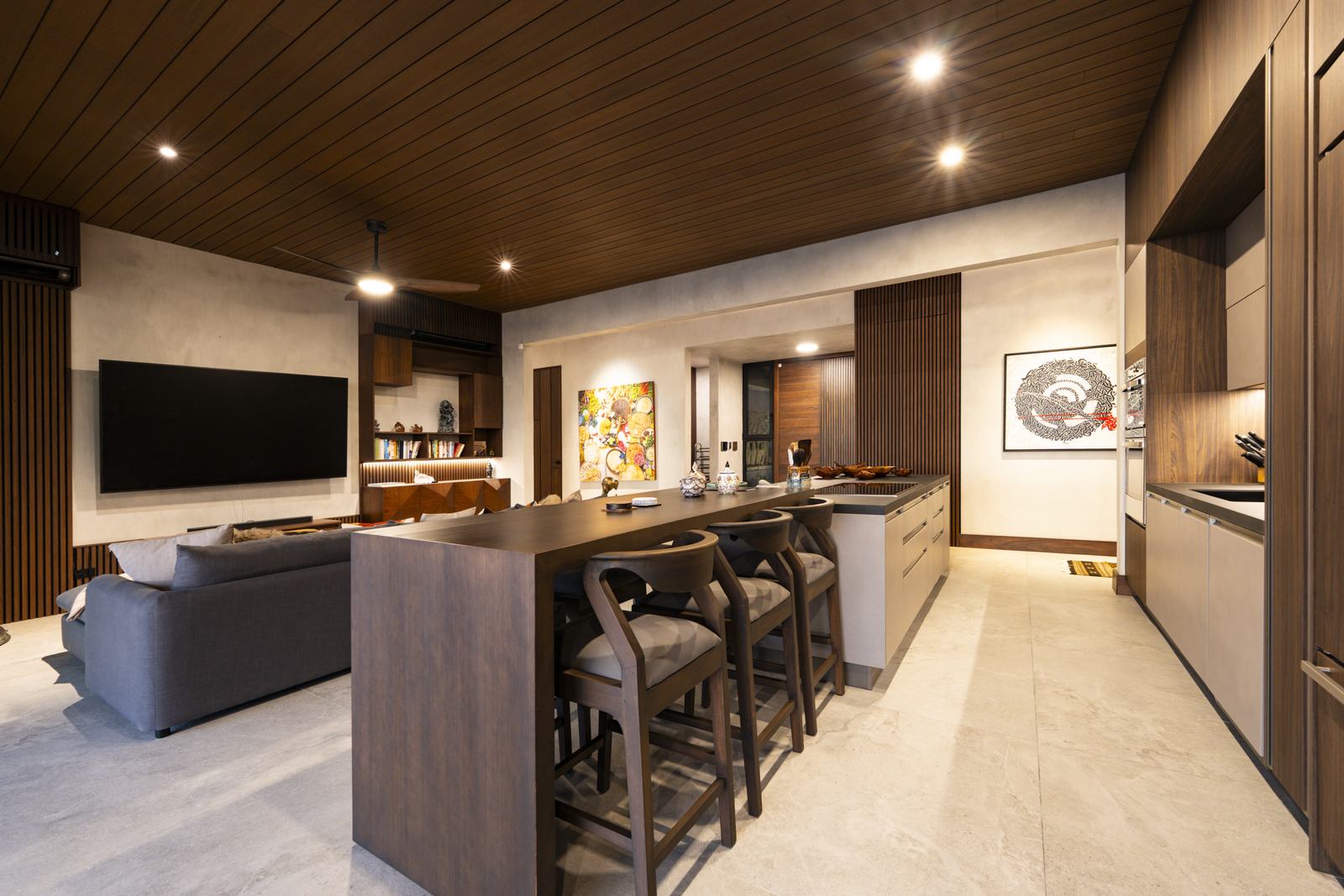 Casa Karuna &mdash; Living room and kitchen, under the timber ceiling