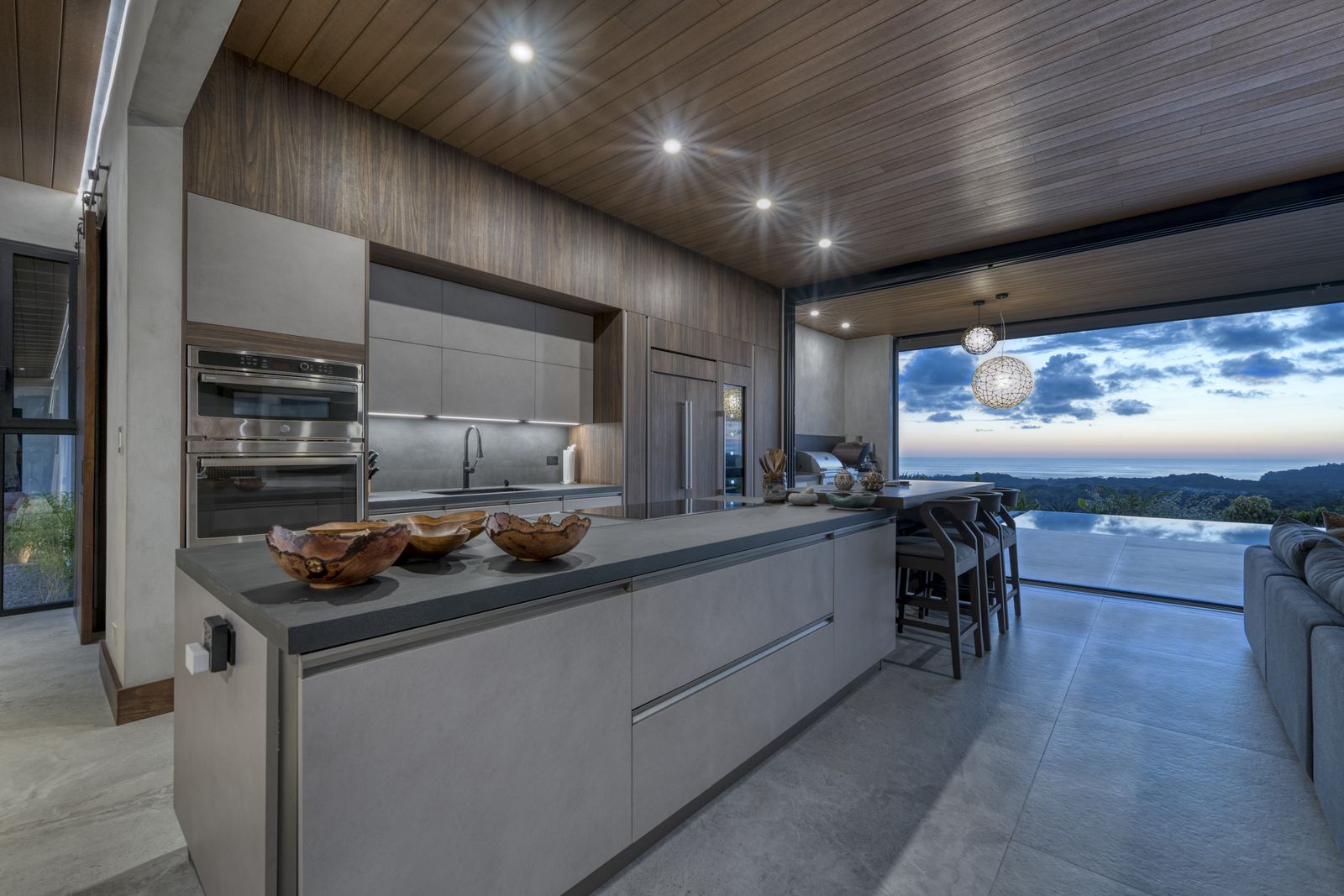 Casa Karuna &mdash; The kitchen, looking out across the pool