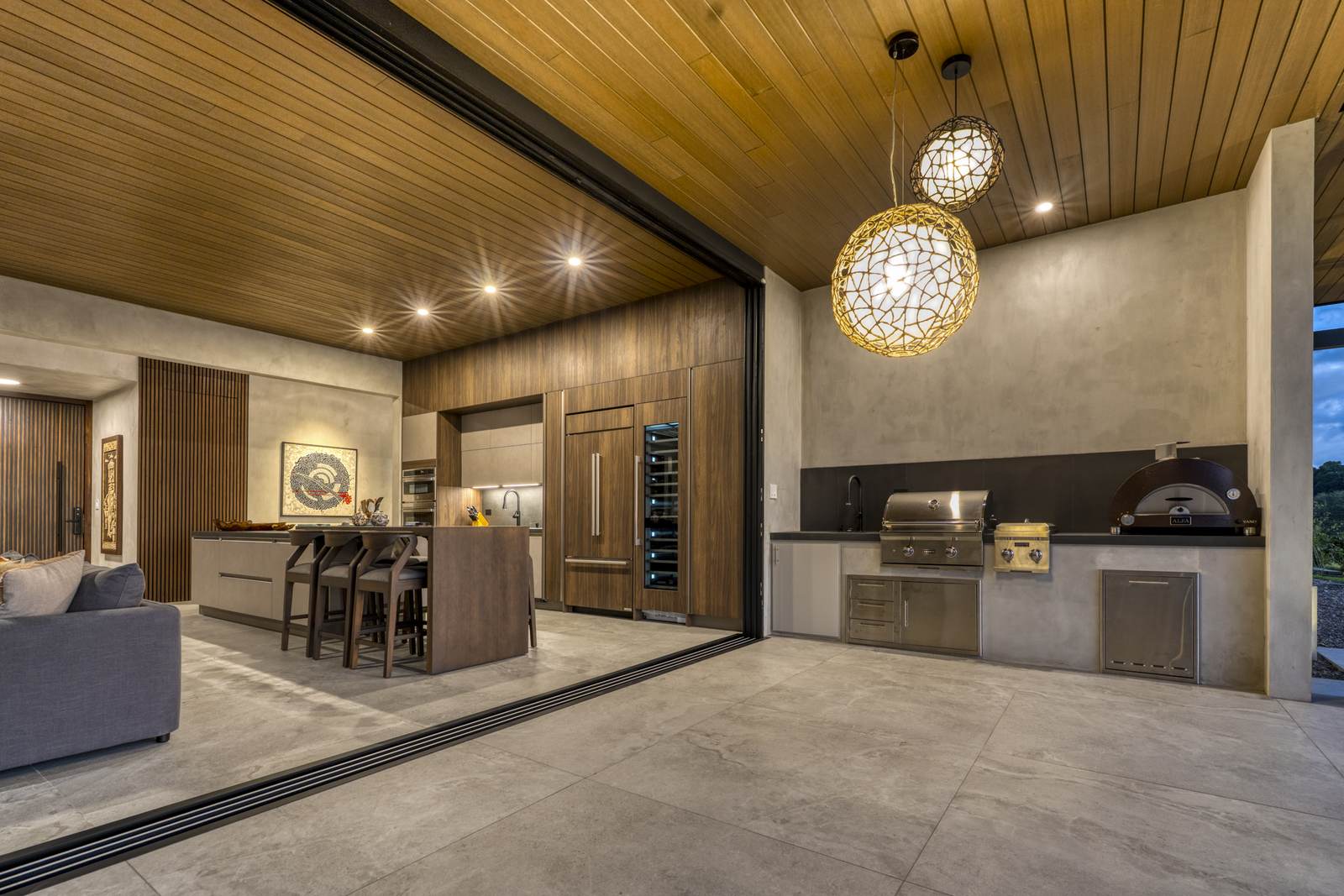 Casa Karuna &mdash; The bar, lit by woven pendants