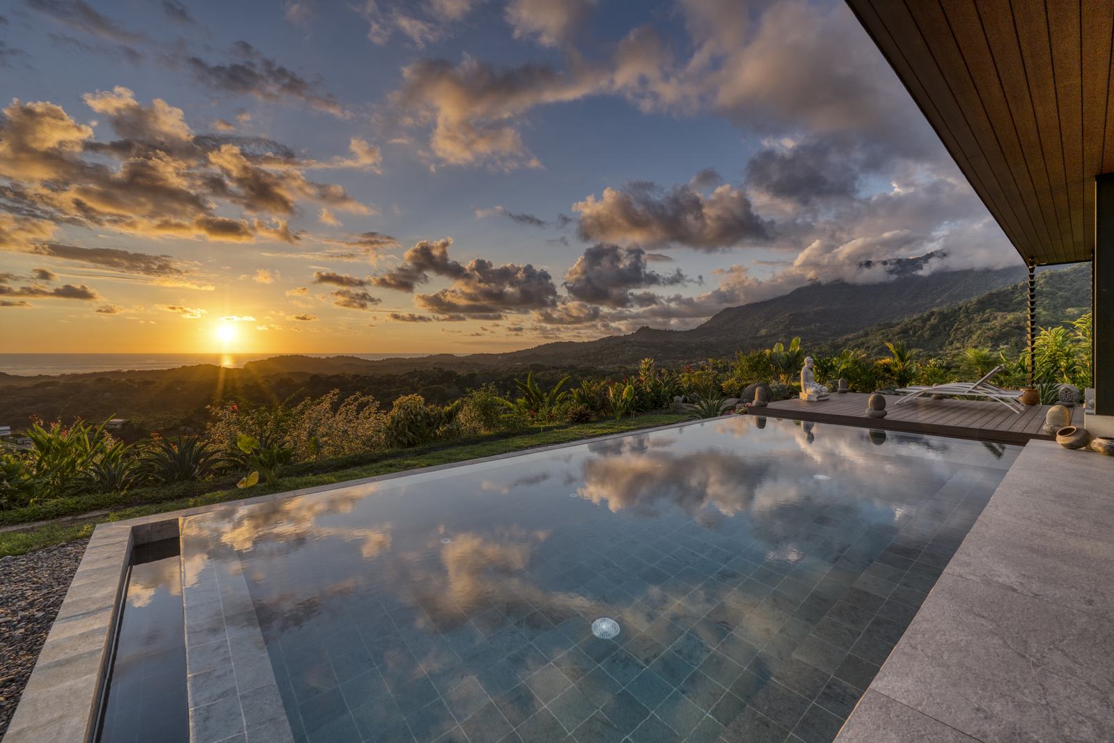 Casa Karuna &mdash; Sunset reflected in the surface of the infinity pool