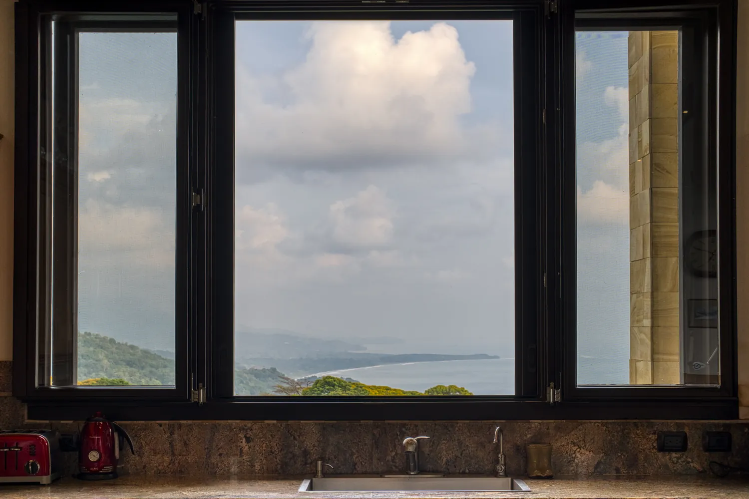 Casa Ladera &mdash; the Whale&rsquo;s Tail framed by the kitchen window