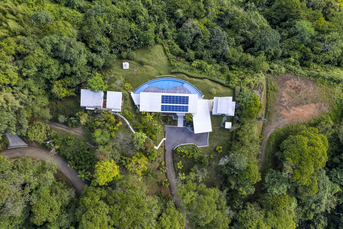 Casa Luz from the air, sitting along its coastal ridgeline in Costa Verde Estates