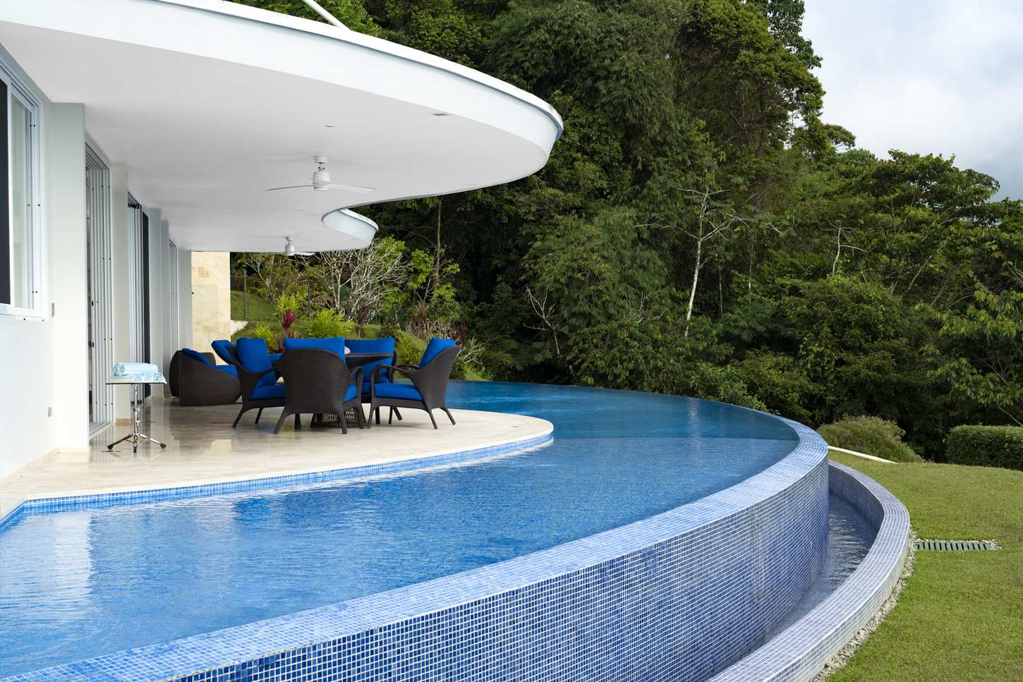 The terrace and pool from the side, open to the canopy