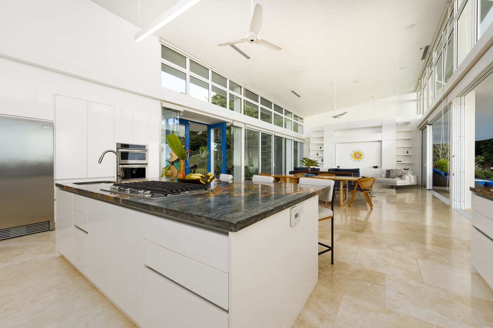 The kitchen, with stone counters and bar seating