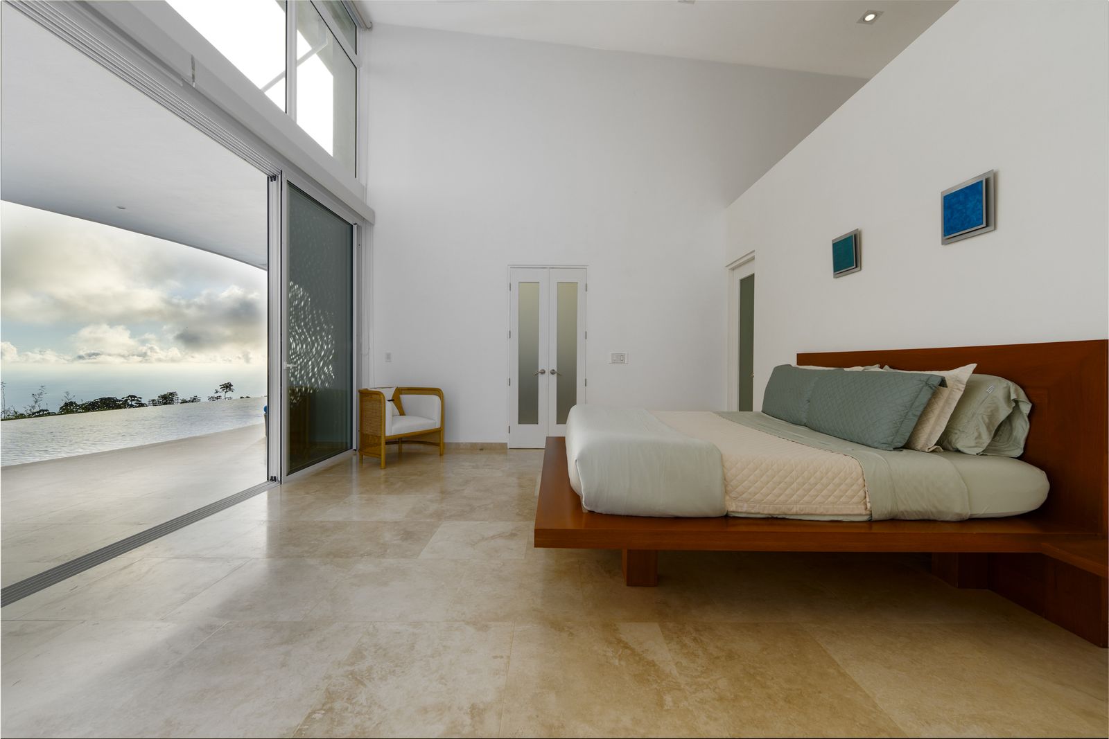 The primary suite, positioned to catch sunrise over the Pacific