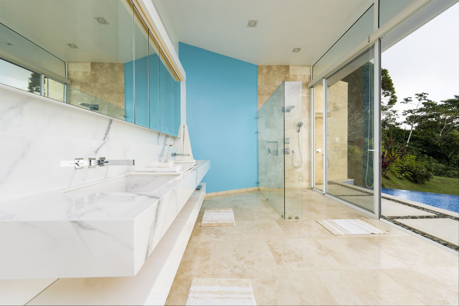 The primary bath, with dual vanities and a garden window