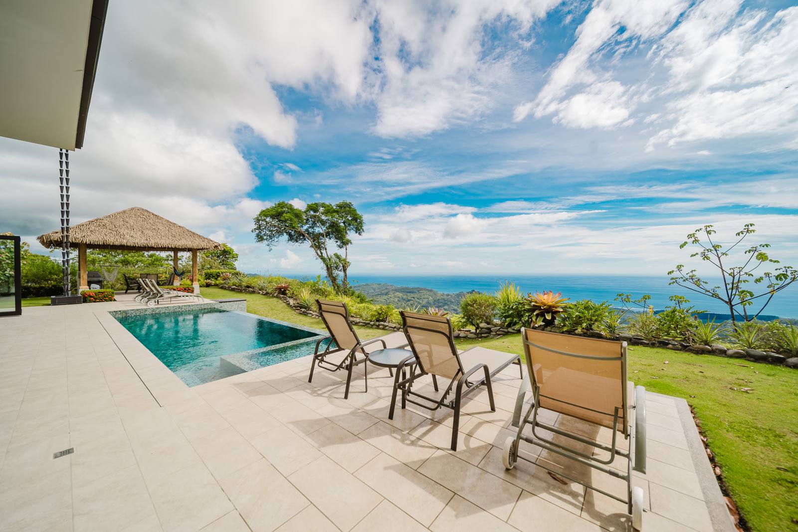 Casa Monta&ntilde;a &mdash; The pool terrace, with the thatched gazebo beyond