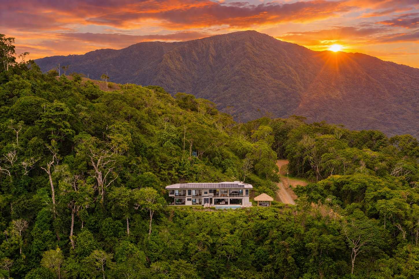 Casa Monta&ntilde;a &mdash; Sunset from the property, the house lit below