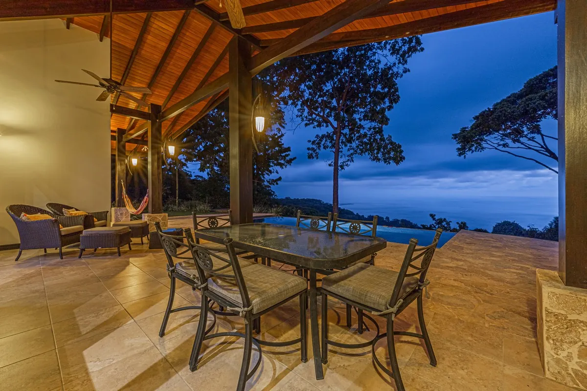 Casa Ola Azul &mdash; the covered terrace and dining table at dusk