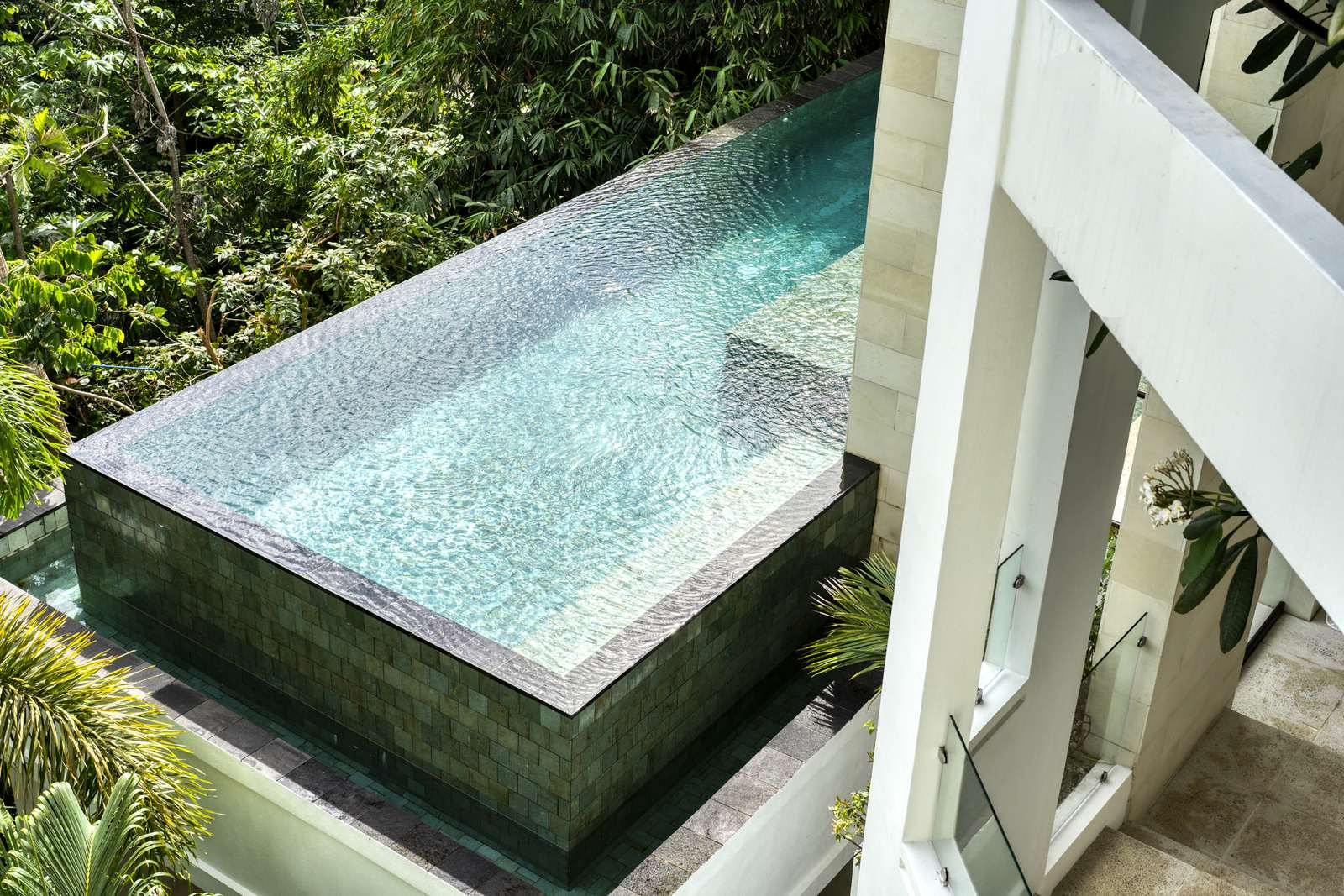 Casa SolAngelo &mdash; the triple-edge infinity pool, fifty feet above the jungle