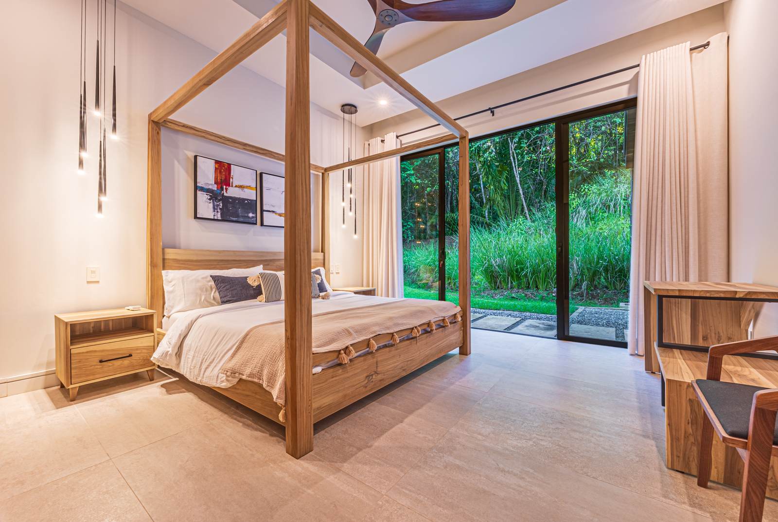 Casa Tango &mdash; A bedroom with a hardwood four-poster bed