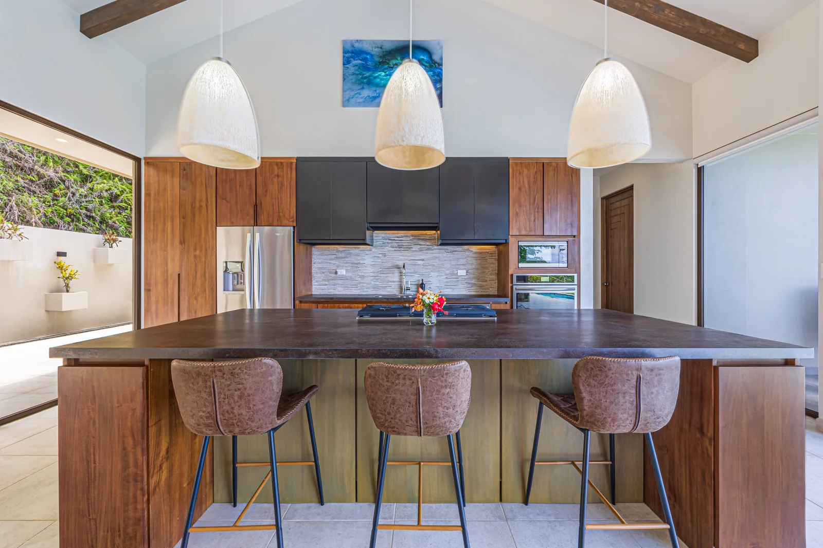 Casa Tranquilidad &mdash; the kitchen island in Melina wood and porcelain