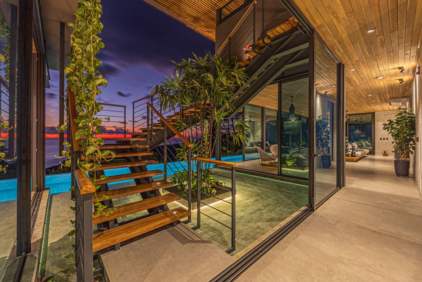 Cascada de Luz &mdash; The pool at night, the house glowing from inside