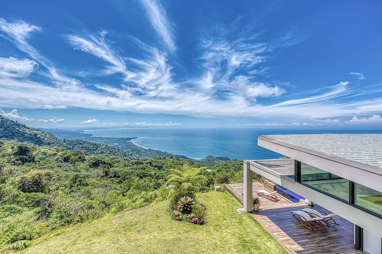 The coastline seen from the edge of the terrace, with the roof of the house at right
