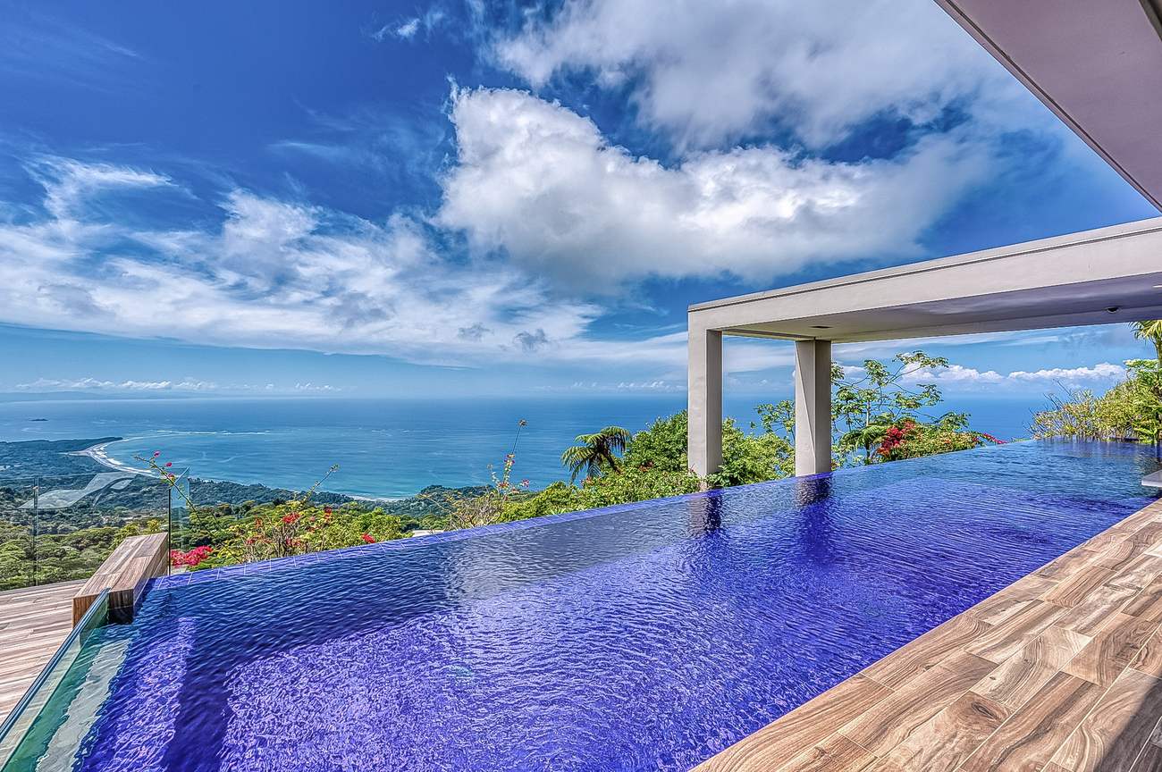 The pool seen through the terrace columns, the coast beyond