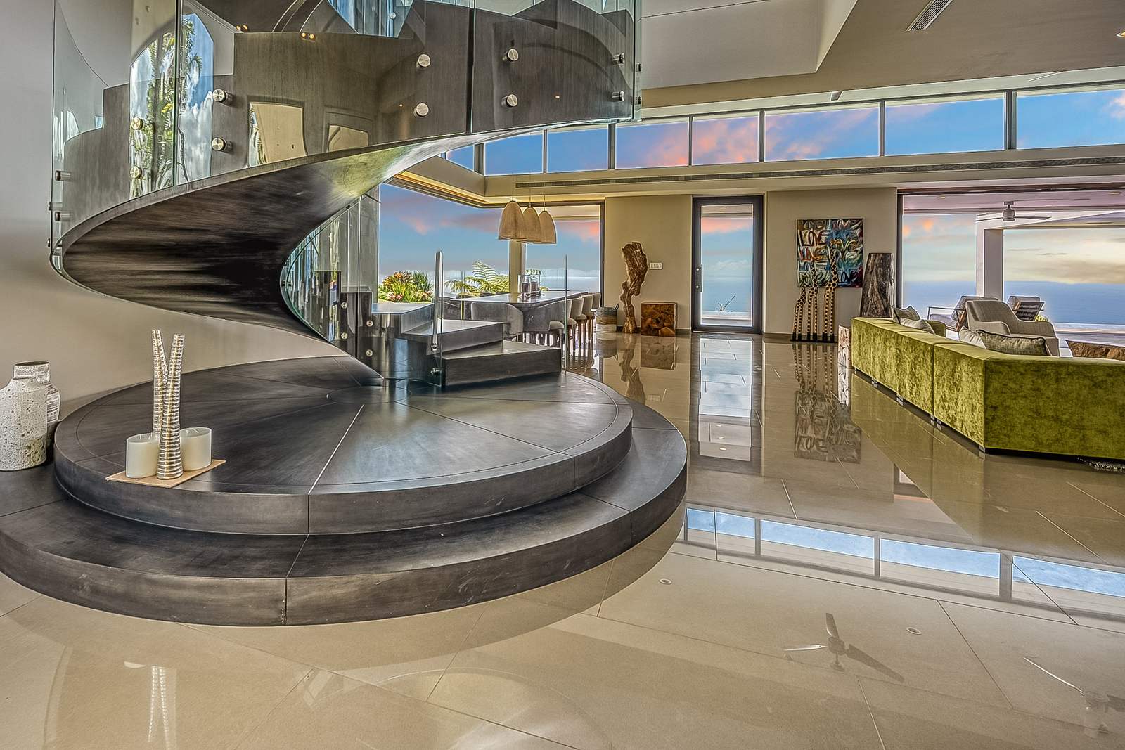 The sculptural spiral staircase at the center of the house