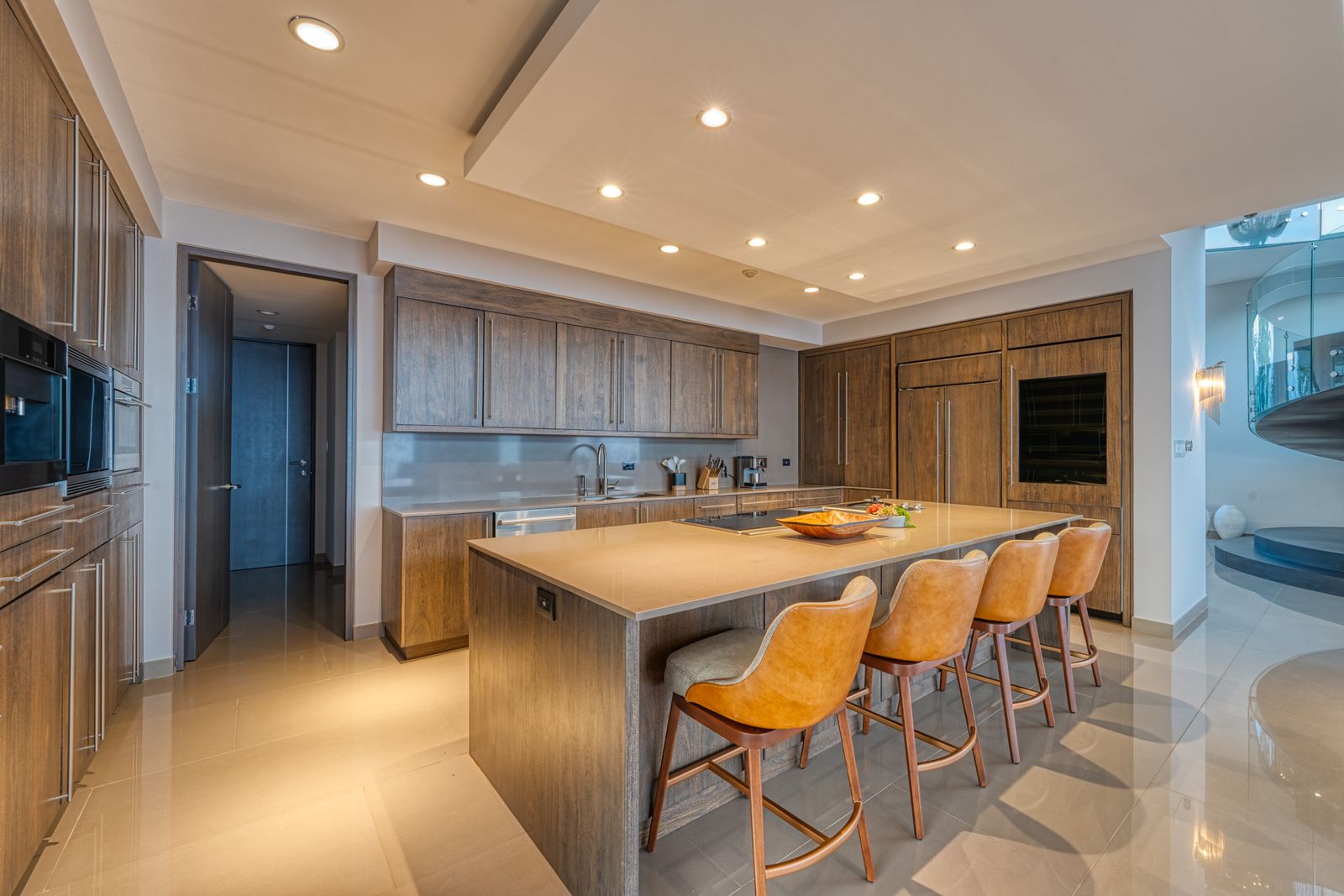 The dining room and kitchen, lit at dusk