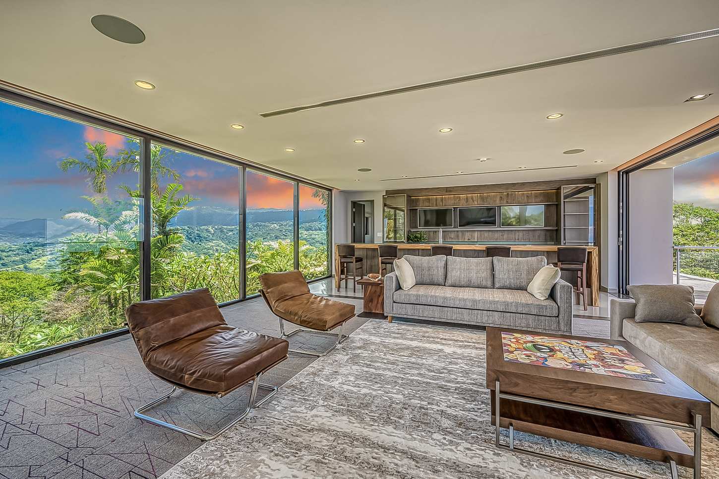 The living room fireplace, with the sunset through the glass