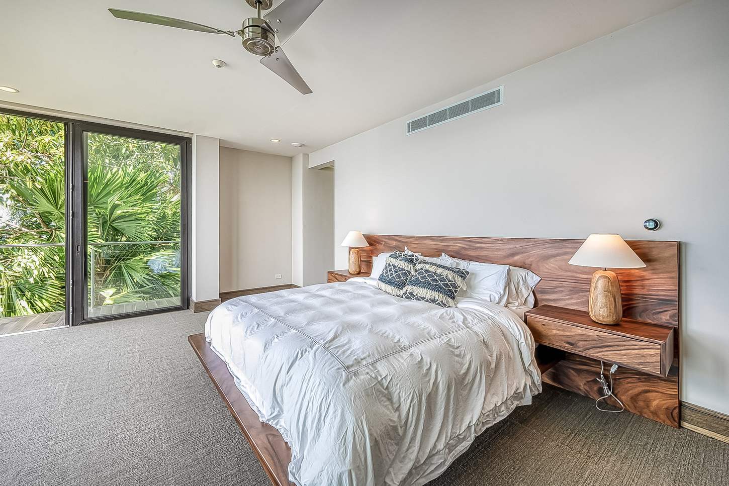 A guest bedroom, opening to the garden