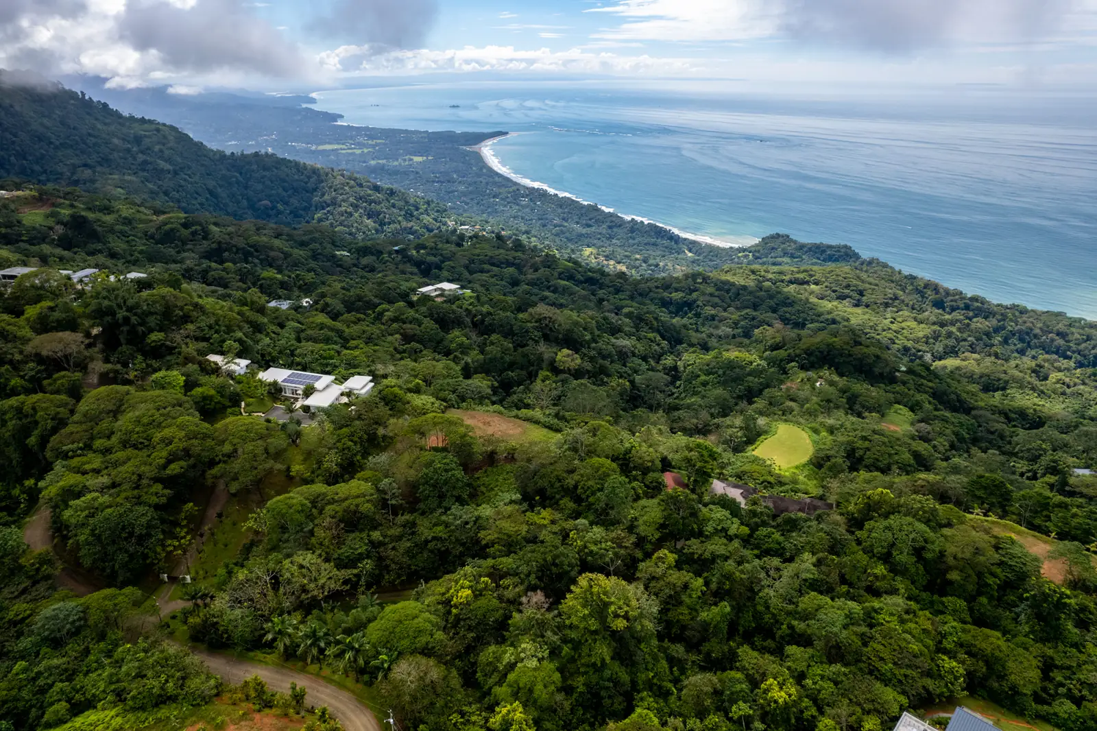 Lot 65 in its setting within Costa Verde Estates, seen from the air with the coast beyond