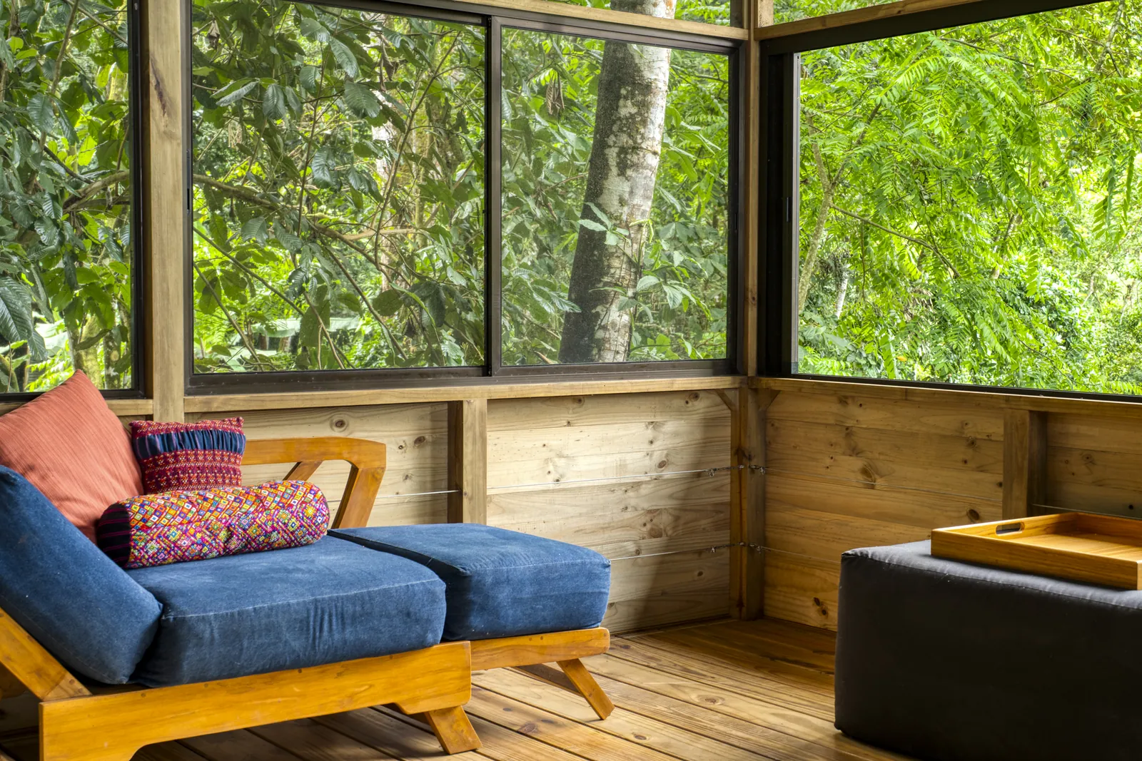 Finca Tres Cascadas &mdash; the main waterfall seen from inside the cabin