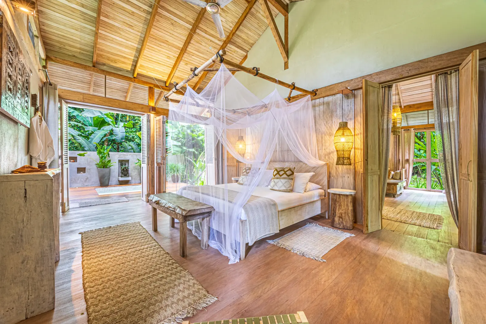 680-acre Golfo Dulce estate &mdash; A bedroom under mosquito netting, open to the garden