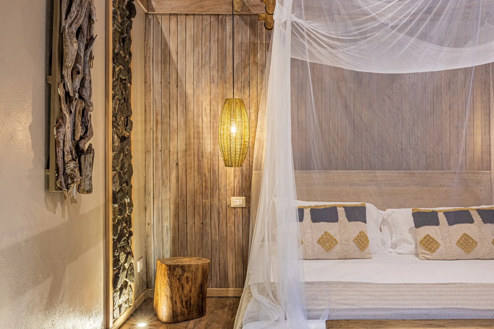 680-acre Golfo Dulce estate &mdash; Carved headboard and lantern in one of the sleeping cabins
