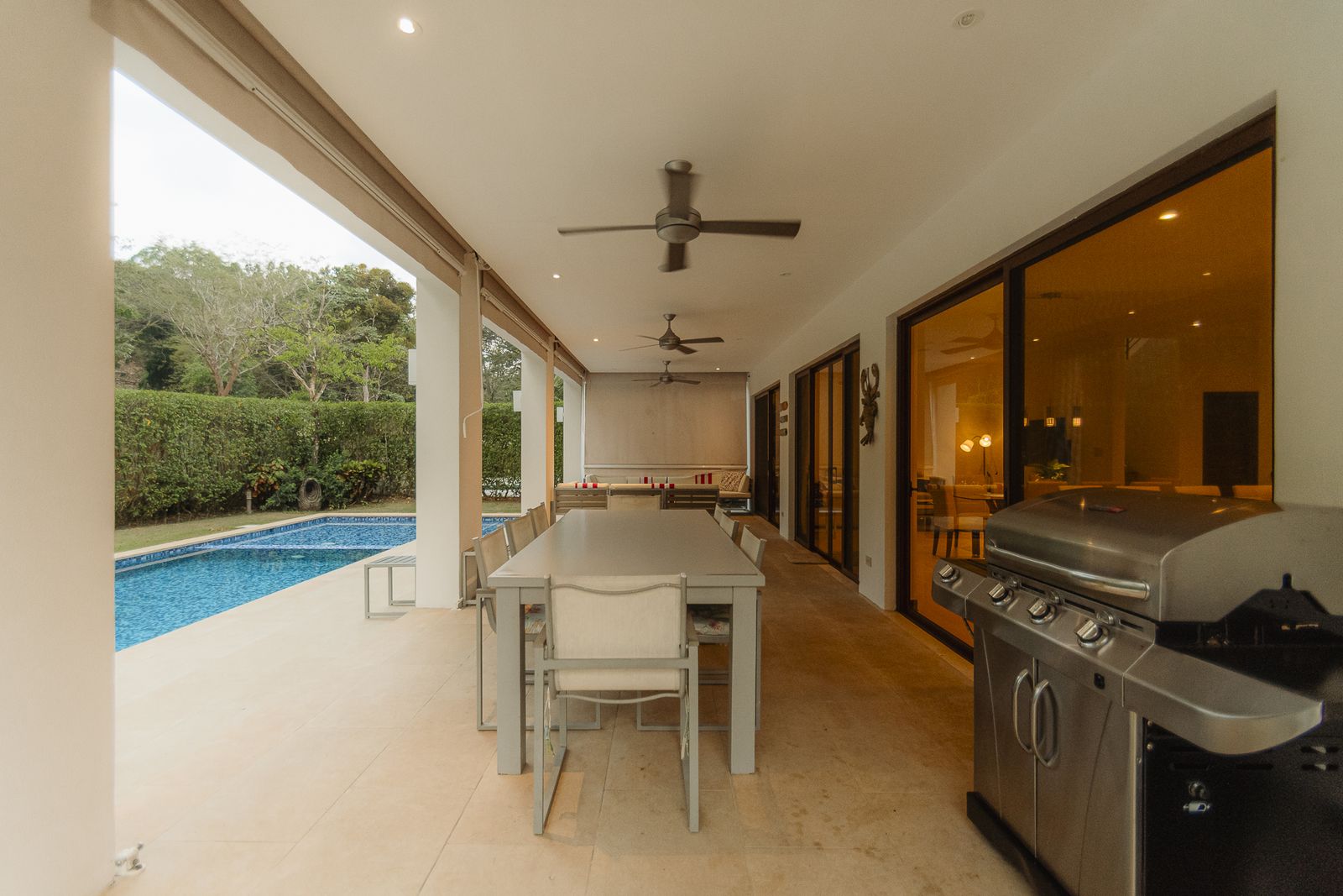 La Estancia &mdash; The covered terrace and outdoor kitchen beside the pool