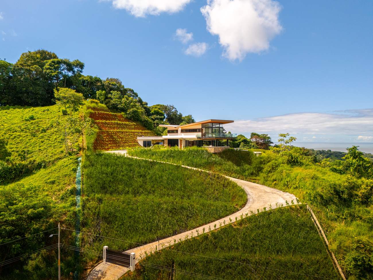Modern Glass Estate &mdash; The house on its ridge above Ojochal