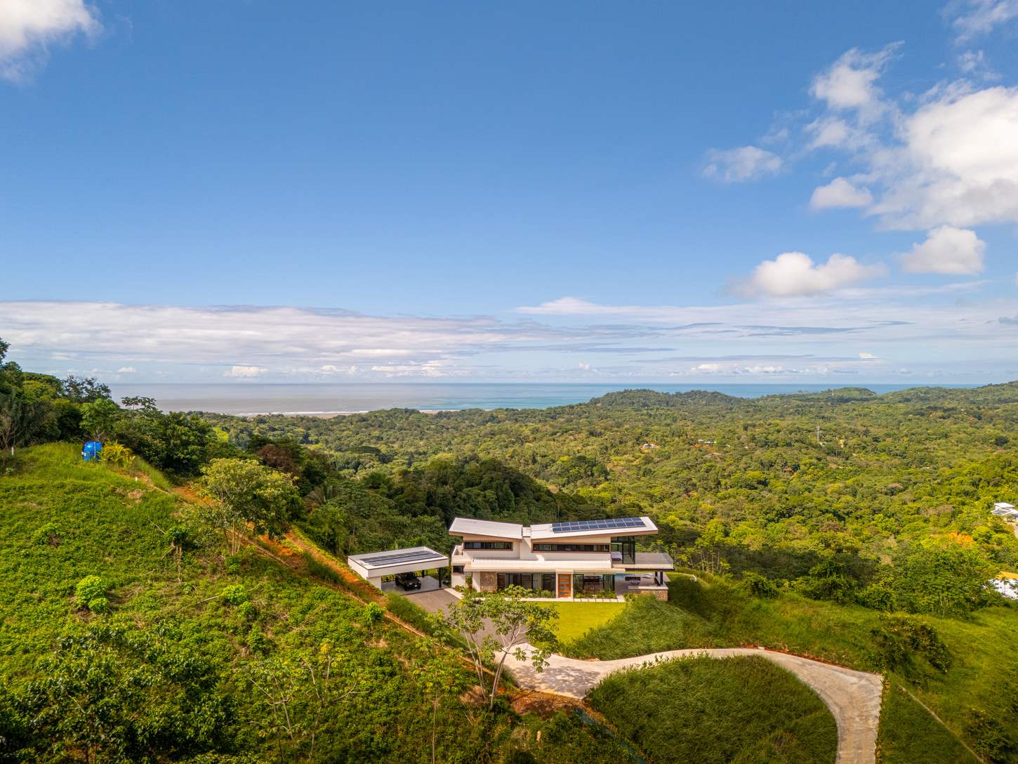 Modern Glass Estate &mdash; The elevation seen from the slope below