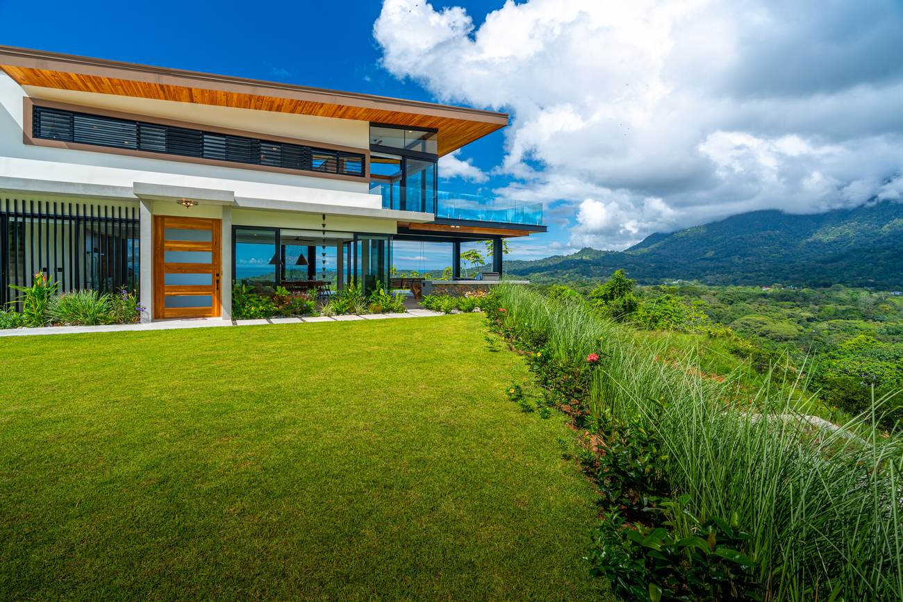 Modern Glass Estate &mdash; The gated entrance and reinforced driveway