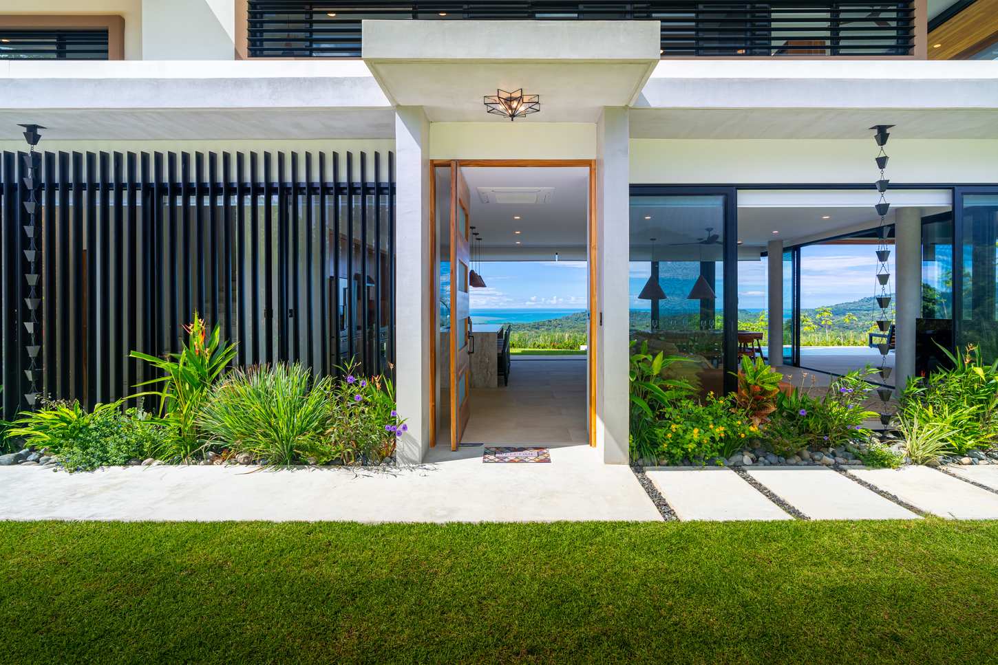 Modern Glass Estate &mdash; The entrance door in solid teak